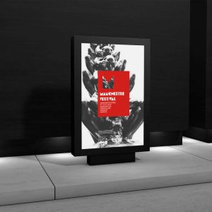 aModern poster featuring a black-and-white artistic image with a bold red square in the centre displaying a stylised "M" and the words "Manchester Festival.