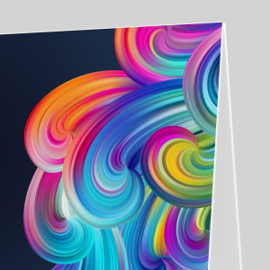 A vibrant A-board with a colorful, swirling abstract design in shades of pink, orange, blue, green, and purple, set against a dark background.
