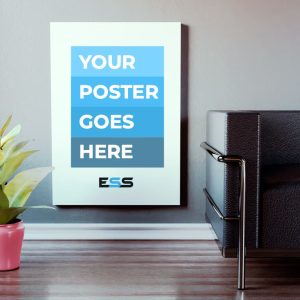 A blank 2A0 poster with the text "YOUR POSTER GOES HERE" in bold white letters on blue blocks, hanging on a light grey wall next to a black leather sofa and a potted plant.