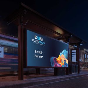 A digital display screen at night showing a colourful abstract background with text about backlit banners.