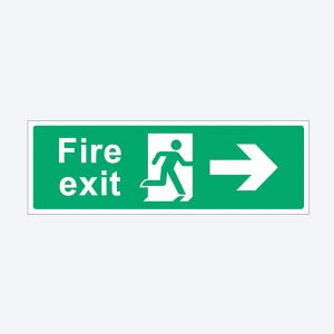 A green rectangular fire exit sign with white text and symbols. The left side displays the words "Fire exit" in bold white letters. In the center, there is a white pictogram of a person running through a door, and on the right, a white arrow pointing to the right, indicating the direction of the emergency exit.