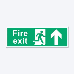 A green rectangular fire exit sign with white text and symbols. The left side displays the words "Fire exit" in bold white letters. To the right, there is a white pictogram of a person running through a door, and an upward-pointing arrow indicating the direction of the escape route.