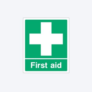A green rectangular first aid sign with a white border. The top features a large white cross symbol. Below the cross, the text "First aid" is written in white letters on a green background.