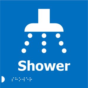 A blue square sign with a white shower head icon, the word "Shower" in bold white letters, and Braille dots below.