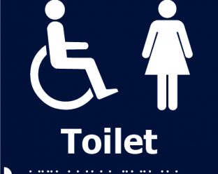 A dark blue square sign with white icons of a person in a wheelchair and a woman, with the word "Toilet" in bold white letters below, and Braille dots beneath.