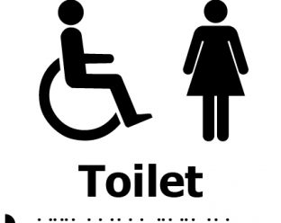 A black-and-white sign with a wheelchair symbol on the left, a female figure on the right, the word "Toilet" in bold text beneath, and Braille dots below the text.
