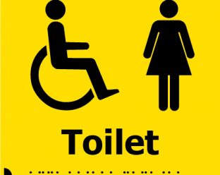 A yellow square sign with black icons of a person in a wheelchair and a woman figure, with the word "Toilet" in bold black letters below, and Braille dots beneath.