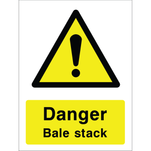 Warning sign with a yellow triangle containing an exclamation mark and the words “Danger Bale stack” in bold black on yellow background