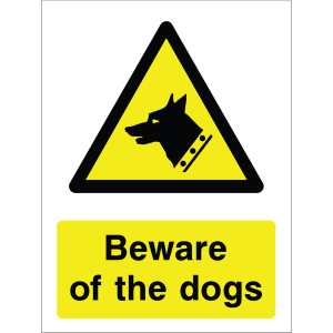 Warning sign with a yellow triangle containing a dog silhouette and the words “Beware of the dogs” in bold black on yellow background