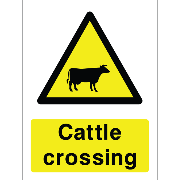Warning sign with a yellow triangle containing a cow silhouette and the words “Cattle crossing” in bold black on yellow background