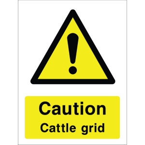 Warning sign with a yellow triangle containing an exclamation mark and the words “Caution Cattle Grid” in bold black on yellow background