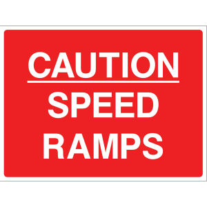 Outdoor "Caution: Speed Ramps" warning sign with white text on red background