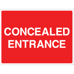 Outdoor "Concealed Entrance" warning sign with white text on red background
