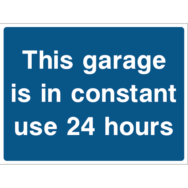 Outdoor "This garage is in constant use 24 hours" warning sign with white text on blue background