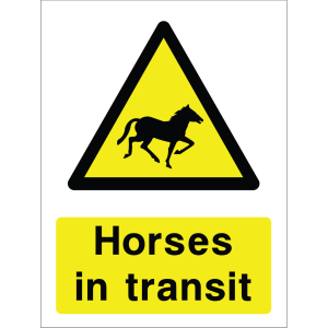 Warning sign with a yellow triangle containing a horse silhouette and the words “Horses in transit” in bold black on yellow background