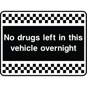 Outdoor warning sign with checkered border and text: "No drugs left in this vehicle overnight"