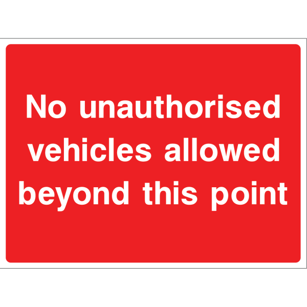Outdoor "No unauthorized vehicles beyond this point" warning sign with white text on red background