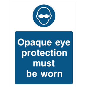 Blue warning sign with an icon of safety glasses with side shields and the message “Opaque eye protection must be worn”