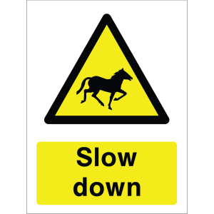 Warning sign with a yellow triangle containing a horse silhouette and the words “Slow down” in bold black on yellow background