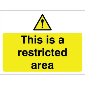 Outdoor warning sign with caution icon and message "This is a restricted area" in black on yellow background