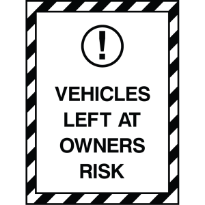 Outdoor warning sign with black text and exclamation icon, stating "Vehicles Left at Owners' Risk," used to inform vehicle owners of risk