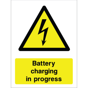 Warning sign showing a lightning bolt icon and the message: "Battery charging in progress" on yellow background, used to warn about active battery charging zones.