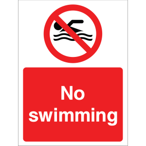 Warning sign showing a circular swimmer icon crossed out and the message: "No swimming" on a red background, used to alert about swimming prohibitions.