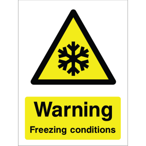 Warning sign showing a black triangle icon with a snowflake and the message: "Warning. Freezing conditions." on yellow background, used to alert about cold weather hazards.