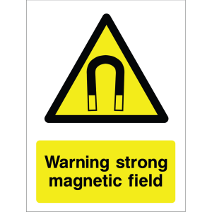 Warning sign showing a black triangle icon with a magnet symbol and the message: "Warning strong magnetic field." on yellow background, used to alert about magnetic hazards.